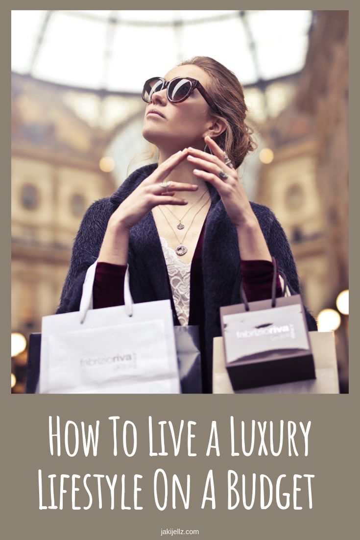 a woman holding shopping bags with the words how to live a luxury lifestyle on a budget