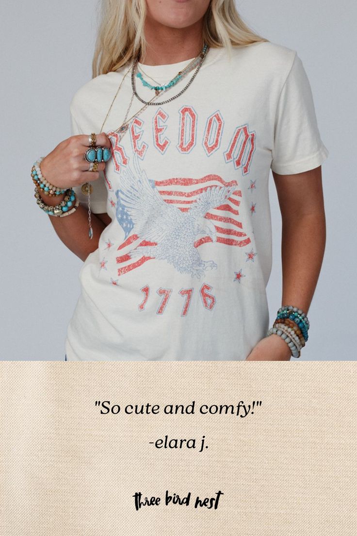 Everyone needs their go - to graphic tee and the Freedom Eagle Graphic Tee is the perfect essential to your boho closet! Comfortable, mineral - washed, Cotton tee shirt fabric Relaxed and loose tee shirt silhouette Classic crew neckline and loose short sleeves So CUTE Distressed Eagle with American Flag and 'Freedom 1776' graphic Pair with: Dora Low Back Seamless Bralette, Straight Arrow Jeans, and Sparrows Song Necklace *Due to lighting and differences in monitors, actual colors may vary slight Spring Crew Neck Stonewashed T-shirt, Trendy Stonewashed T-shirt For Spring, Trendy Stonewashed Cotton T-shirt, Trendy Stonewashed T-shirt For Summer, Bohemian Crew Neck Washed Tops, Bohemian Washed Crew Neck Tops, Stonewashed Graphic Tee For Spring, Spring Stonewashed Graphic Tee, Trendy Stonewashed Summer Tops