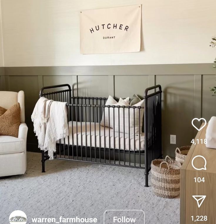 a baby crib in the corner of a room next to a couch and chair