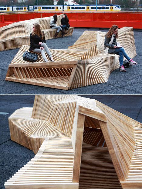 two women sitting on benches made out of wood