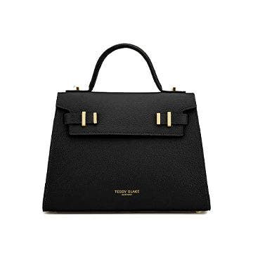 Introducing New Ava by Teddy Blake, Italy-crafted chic bag. Grained calf leather, single handle, flap closure, organized suede interior. Day-to-night elegance Made in Italy Italian Leather Handmade by Experts Elegant Satchel With Top Handle And Fold Over Clasp, Elegant Top Handle Satchel With Fold Over Clasp, High-end Luxury Satchel Flap Bag, High-end Everyday Luxury Satchel Flap Bag, Luxury Double Handle Shoulder Bag With Fold Over Clasp, Elegant Formal Satchel With Fold Over Clasp, Luxury Flap Bag With Top Carry Handle, Chic Luxury Everyday Bag With Flap, Leather Top Handle Satchel With Fold Over Clasp