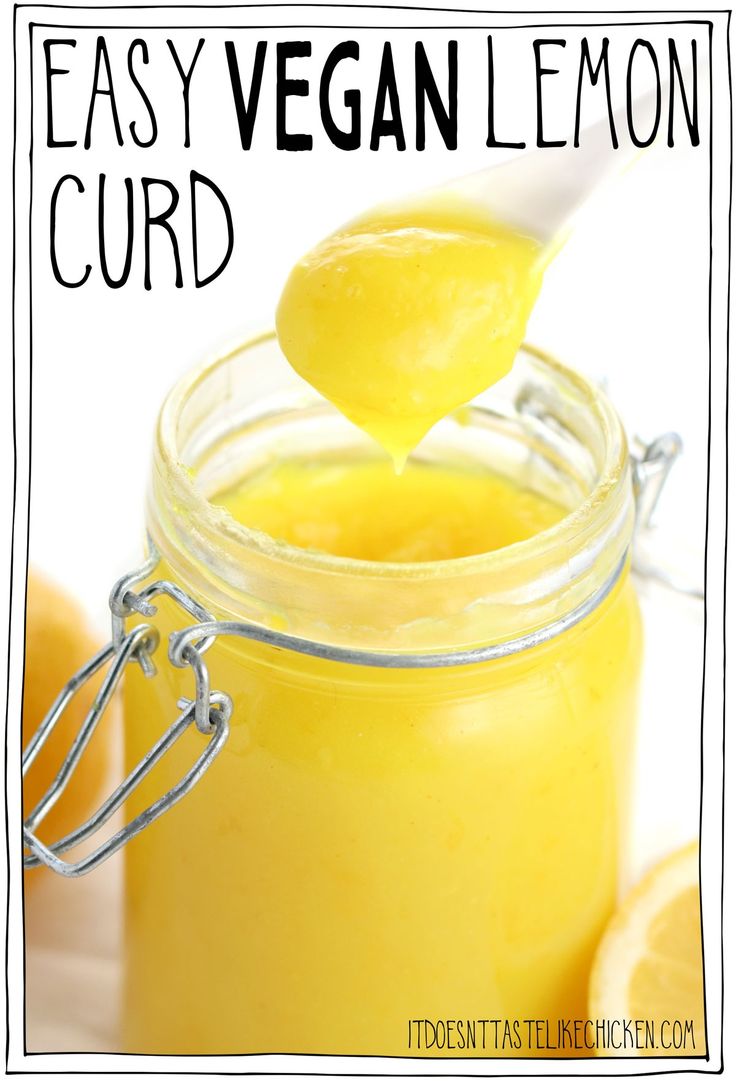 a jar filled with lemon curd and a spoon full of liquid next to it