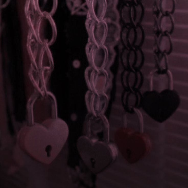 several heart shaped key chains hanging from the ceiling