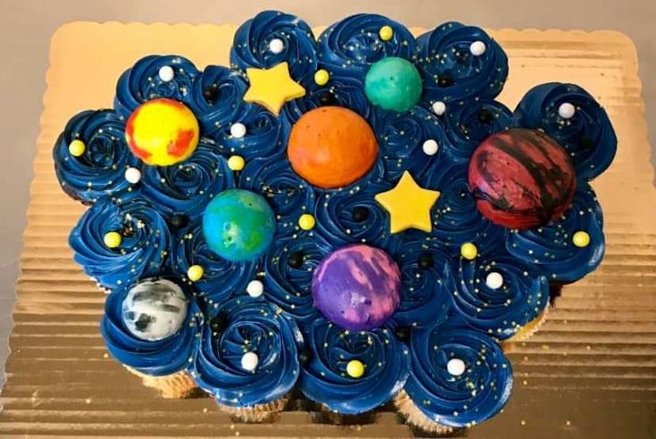 a cupcake with planets and stars on it