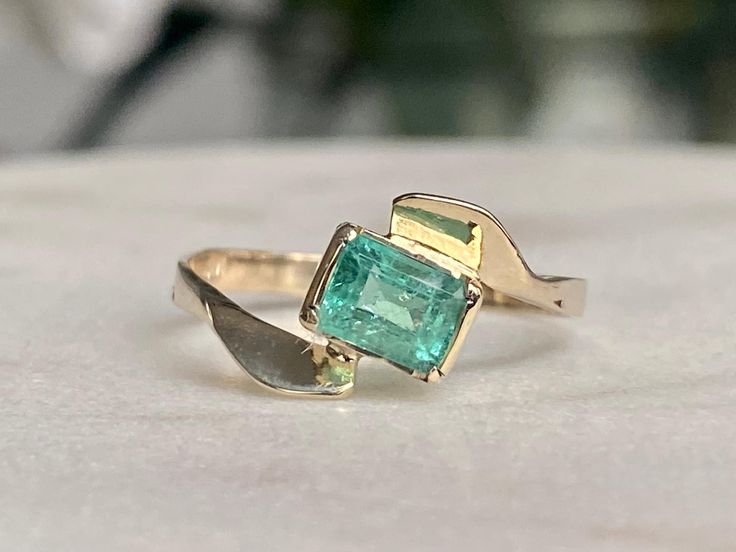 Colombian emerald ring,   14k gold,   Size 6 0.8 carats We only sell genuine natural emeralds directly from the Colombian mines of Chivor, Muzo, and Coscuez. The emerald mines of Chivor, Muzo, and Coscuez provide the best quality emeralds in the world because of their characteristics of color and clarity. The rarest and most expensive emeralds in the world have been discovered in these mines. Fine Jewelry Emerald Ring With Tension Setting, Elegant Green Emerald Ring With Tension Setting, Green Emerald Ring With Tension Setting, Emerald Jewelry With Tension Setting In Emerald Cut, Emerald Cut Emerald Jewelry With Tension Setting, Emerald Cut Ring With Tension Setting In Emerald, 14k Gold Gia Certified Emerald Ring For May Birthstone, Gia Certified 14k Gold Emerald Ring For May Birthstone, 14k Gold Emerald Ring With Tension Setting