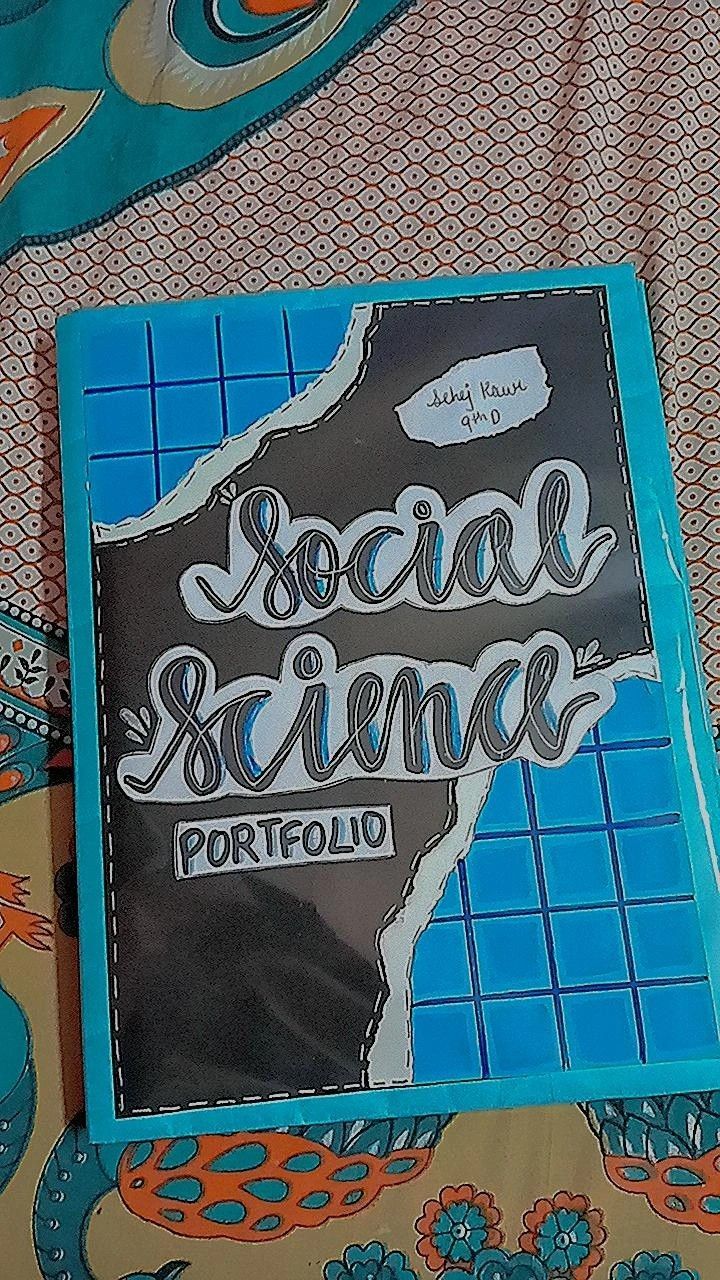 a book sitting on top of a bed covered in blue and orange sheets with the words social science