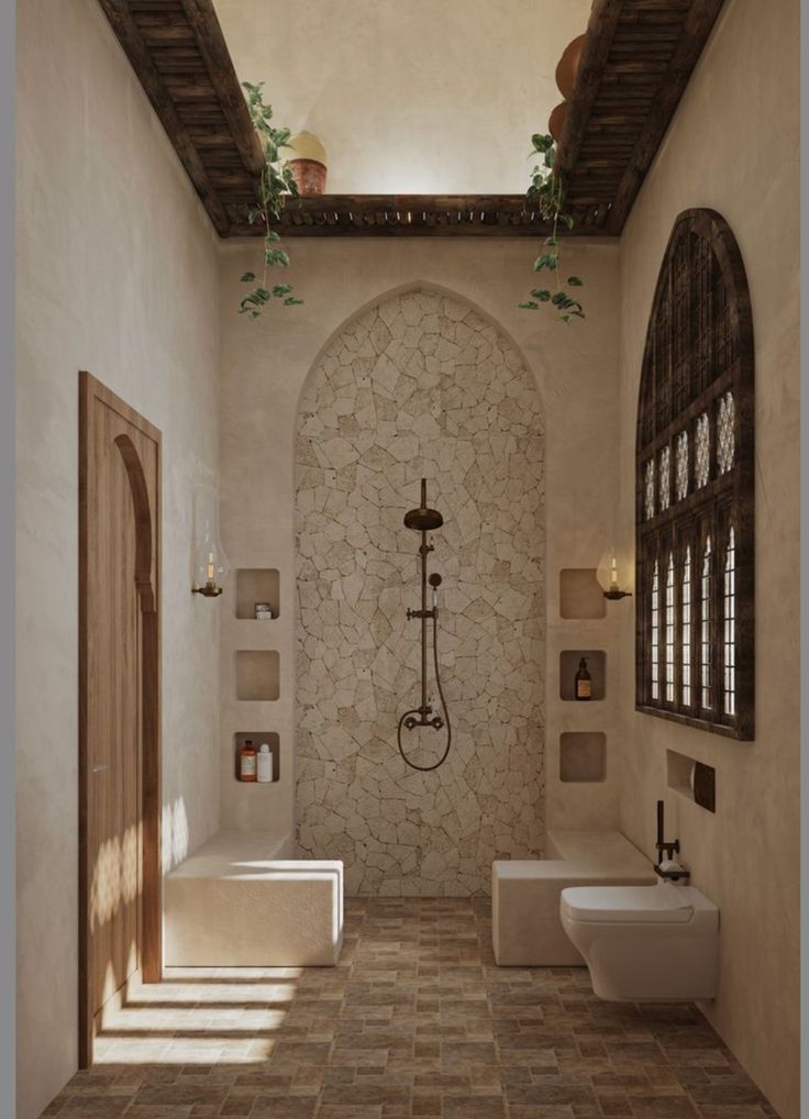 a bathroom with stone walls and tiled floors