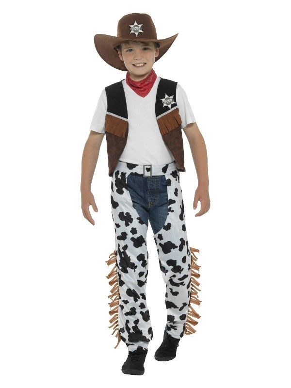 a young boy wearing a cowboy costume