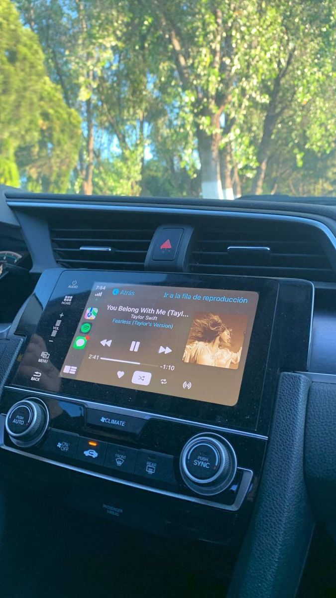 the dashboard of a car with an electronic device in it