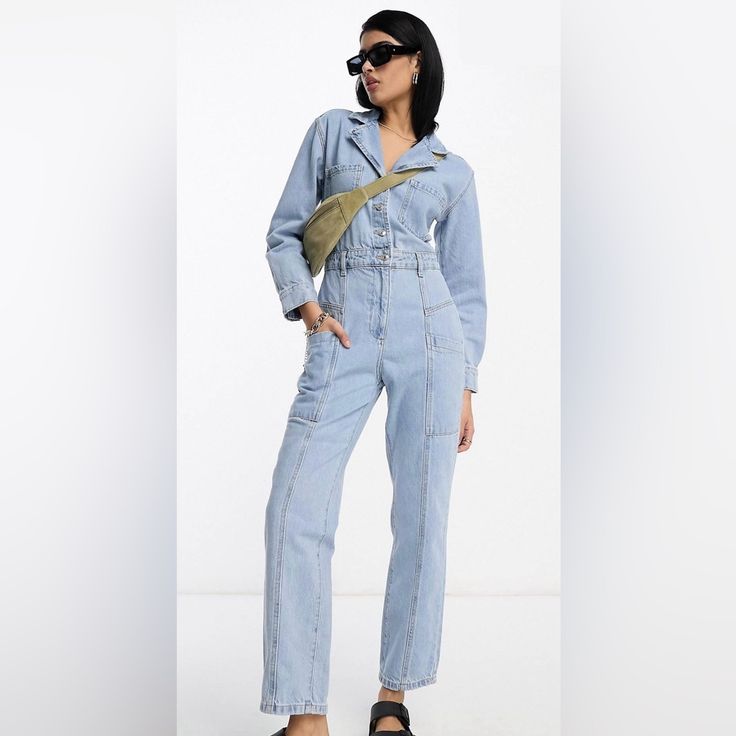 Never Worn. Soft Cotton Denim Boilersuit. Tags Still On. Straight Leg. Long Sleeve With Button Cuffs. Button Up Top And Waist. Zipper Pants Closure. Plenty Of Pockets On Chest, Back, And Sides. Cute For Any Season. Dress Up Or Dress Down. Not For Petite. Measurements Laying Flat: - Total Height (Shoulder To Ankle): 57 In. - Pit To Pit: 22 In. - Waist: 17.5 In. - Inseam: 28 In. Spring Light Wash Denim Jumpsuit For Work, Spring Light Wash Overalls For Workwear, Utility Blue Denim Jumpsuit For Spring, Blue Utility Denim Jumpsuit For Spring, Blue Utility Jumpsuits And Rompers For Spring, Light Wash Overall Jumpsuit For Work, Blue Denim Jumpsuit With Buttons, Blue Denim Jumpsuit With Buttons For Work, Blue Buttoned Denim Jumpsuit For Work