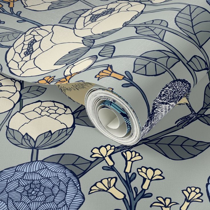 a blue and white floral wallpaper with birds on it