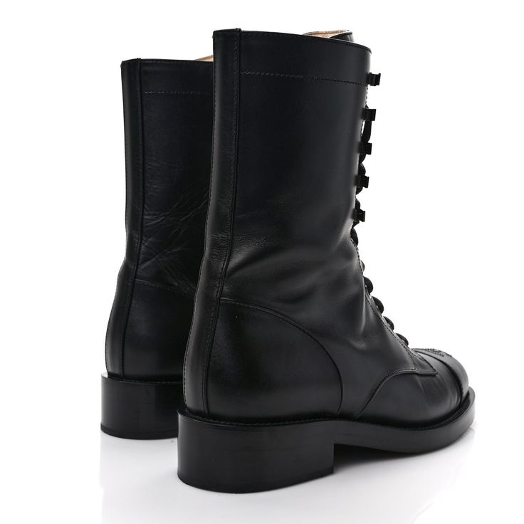 This is an authentic pair of CHANEL Crumpled Calfskin Lace Up Combat Boots size 37 in Black. These stunning boots are crafted of calfskin leather in black. The boots feature a 1.25-inch heel and a leather cap toe with a stitched Chanel CC logo. Lace Up Combat Boots, Leather Cap, Cc Logo, Calf Skin, Combat Boots, Dust Bag, Lace Up, Thing 1, Chanel