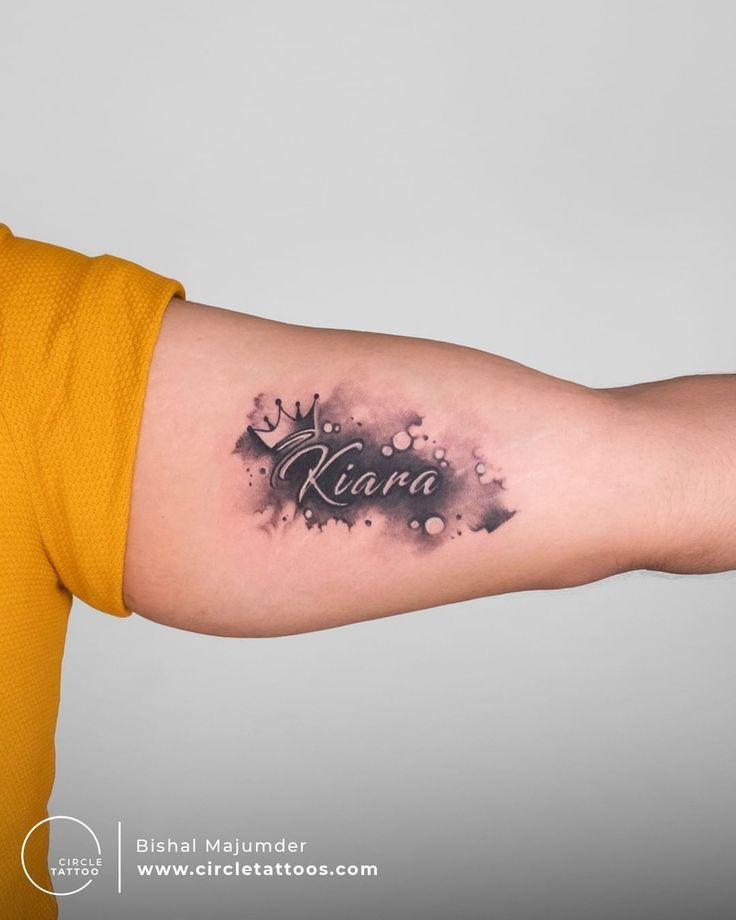 a man with a tattoo on his arm that says roma in black ink and the word roma