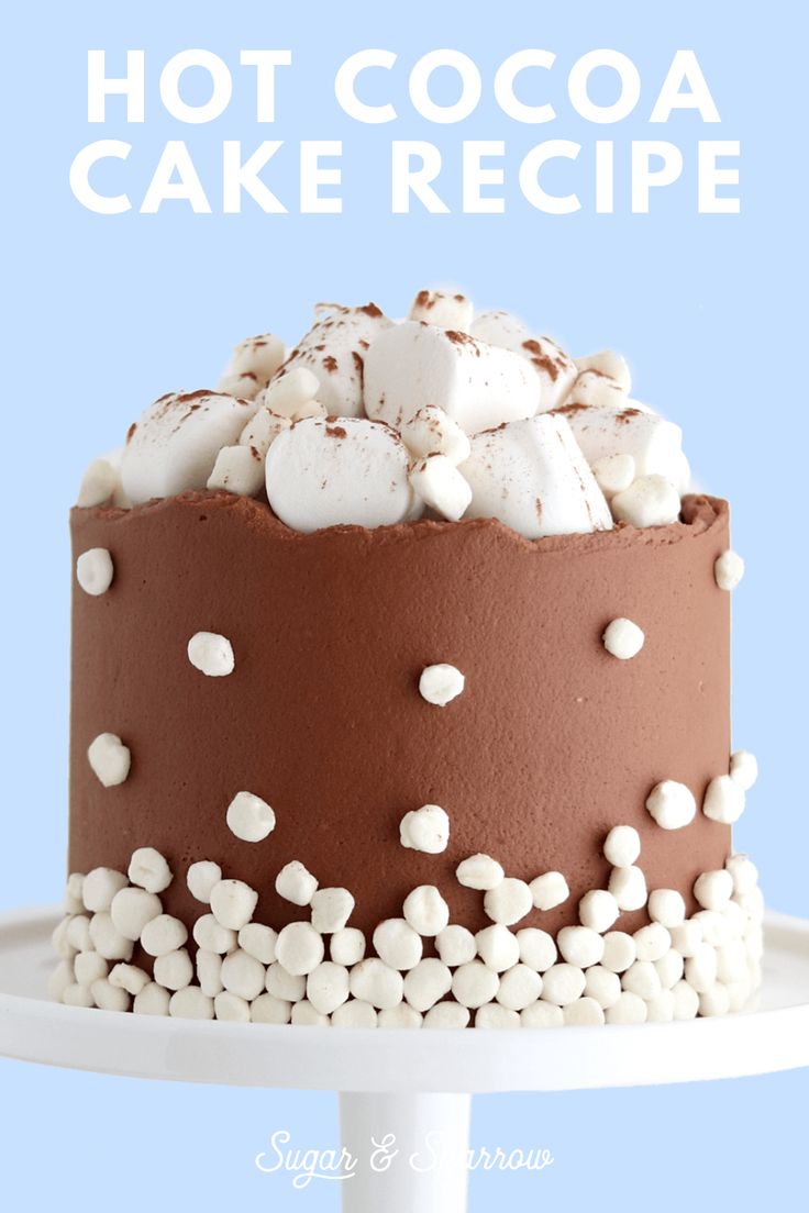 there is a chocolate cake with marshmallows on top and the words hot cocoa cake recipe above it