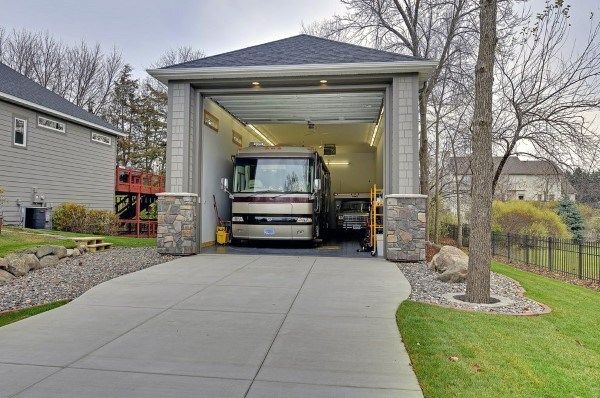 a truck is parked in the garage with its door open to let people know what's inside