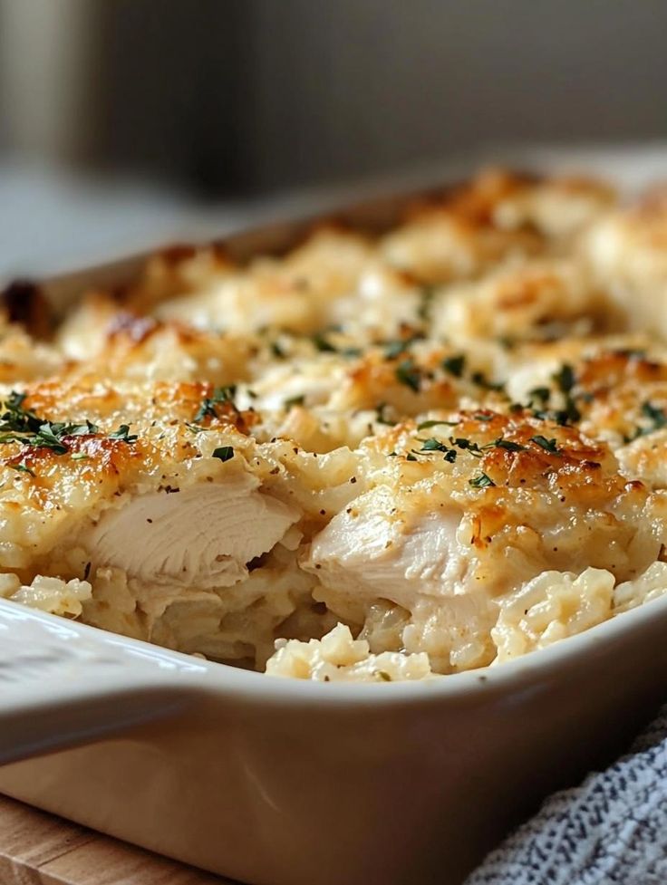 a casserole dish with chicken and cheese