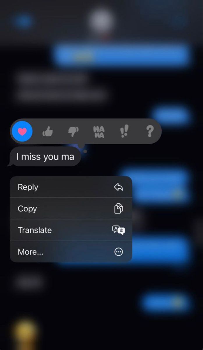 an iphone screen with the message'i miss you ma'highlighted in blue text