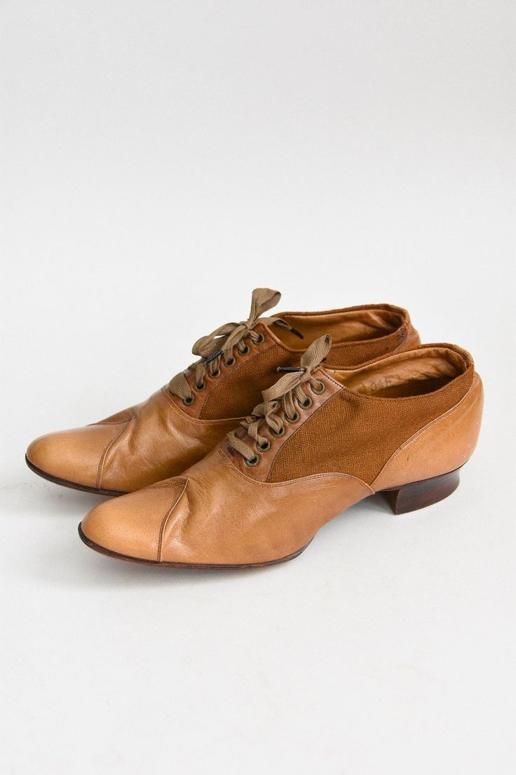 "Antique Edwardian (early) era leather walking shoes. Camel colored leather mixed with canvas. Rounded toe with stitching detail. Wooden heel. Front lace ties. A wonderful representation of attention to detail and lasting craftsmanship. State of garment | very good for age, minimal wear on soles. small repair on left shoe, refer to photos. Measurements ✂--- best fit | Modern 5 1/2 N - 6 N * please refer to measurements below length | 9.5\" width | 2.75\" label | 3 1/2 E ★★Visit The Shop★★ http:/ Retro Brown Leather Lace-up Shoes, Vintage Brown Lace-up Shoes With Rubber Sole, Brown Cap Toe Oxfords With Laces, Brown Leather Almond Toe Shoes With Laces, Brown Almond Toe Leather Shoes With Laces, Brown Lace-up Oxfords For Galas, Lace-up Oxfords With Leather Sole For Galas, Brown Almond Toe Lace-up Shoes With Rubber Heel Cap, Vintage Brogue Lace-up Boots