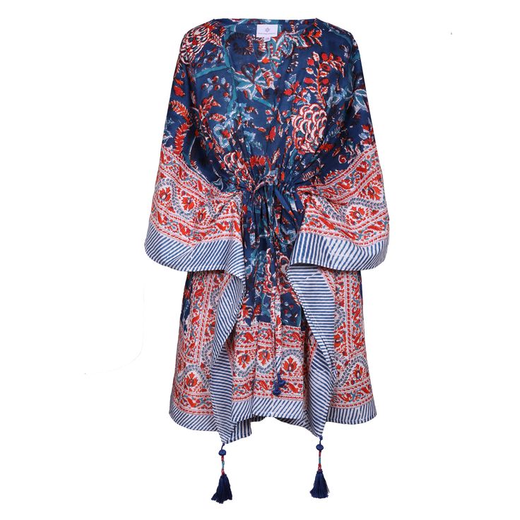 Our Bhawani Blue Floral Short is a beautiful all over floral kaftan dress! You can wear it so many different ways - slip it on over a bikini at the beach as a cover up or style it with sandals and stacked jewelry for dinner. It's made from natural fibers and hand block printed with a bold flower pattern! Subtle variations in colour and pattern are to be celebrated as they are evidence of the hand made block printing and dyeing process that makes this dress unique. This dress is the epitome of cl Summer Patterned Kimono For Beach Cover-up, V-neck Floral Print Festival Cover-up, Bohemian V-neck Kaftan For Brunch, Patterned Kaftan For Summer Beach Cover-up, Boho Print Cover-up With Kimono Sleeves For Beach Season, V-neck Floral Print Tunic For Beach Cover-up, Blue Boho Dress For Beach Cover-up, Traditional Kimono For Beach Cover-up In Spring, Summer Beachwear Kaftan With Back Tassel Tie-up