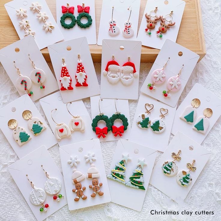 a bunch of christmas themed items are on display in a wooden box with cards and magnets