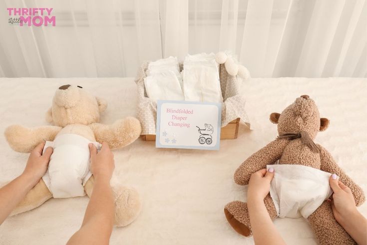 two teddy bears sitting on top of a bed next to a person holding a pillow