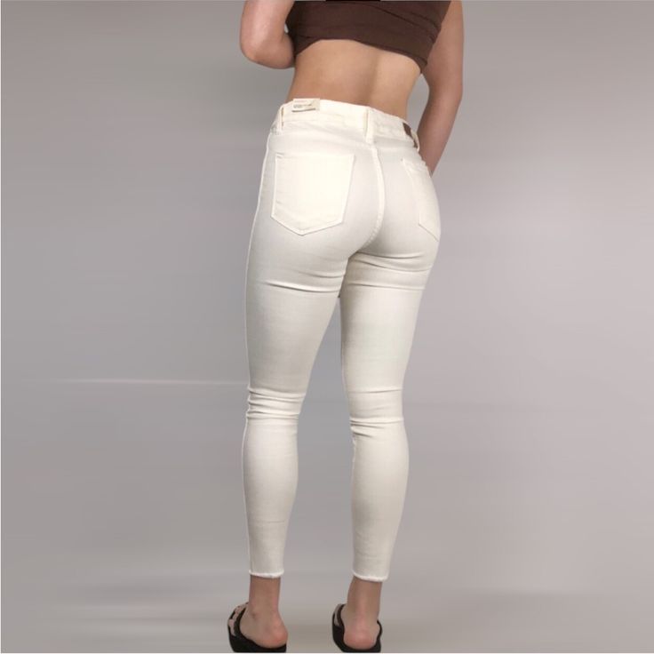 Brand New, No Flaws! Hit Refresh On White-Jeans Season In These High-Waisted, Snowy Skinnies Raw-Cut To Hit Right At The Ankle. High Waisted Raw Hem Stretchy Zip Fly With Button Closure Measurements: Inseam: 26” Waist: 14” Rise: 11” Hip: 17” Model Measurements: | Height 5’7” | Bra Size 34b | Waist 28” | Hips 36” High Rise Bottoms For Everyday Winter Wear, High Rise Stretch Beige Bottoms, Beige High Rise Stretch Bottoms, High Waist Jeggings For Spring, Beige Stretch High Rise Jeans, Trendy White Winter Bottoms, Cream Cropped Leg Fall Jeans, Cream Cropped Leg Jeans For Fall, Fall Cream Cropped Leg Jeans