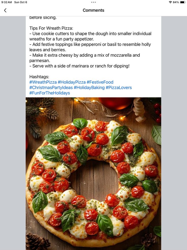 a pizza sitting on top of a wooden table next to pine cones and christmas decorations