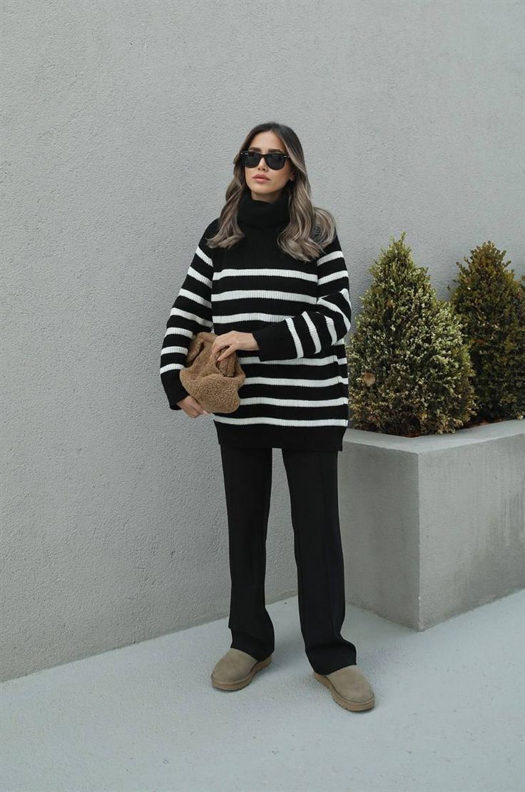 Adopt a chic and casual look with our black and white striped sweater. This turtleneck sweater is a must-have for a clean and trendy style. Designed to be both cozy and stylish, it will wrap you in comfort while making a bold fashion statement. Long sleeves and a loose fit offer a modern, relaxed silhouette, perfect for cool days. Wear it with fitted pants for a striking contrast or with jeans for a more casual look. An essential for any wardrobe that prioritizes style without compromising on comfort. Black And White Striped Sweater Outfit Winter, Black And White Striped Turtleneck, Winter Pullover Outfits, Striped Sweater Outfit, Striped Turtleneck Sweater, Black And White Fashion, Winter Sweater Outfits, Fitted Pants, White Striped Sweater