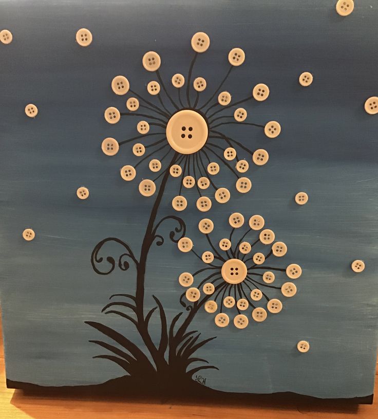 a painting with buttons in the shape of a dandelion