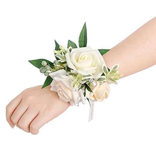 a wrist corsage with white flowers and greenery