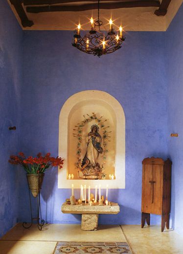 a room with blue walls and a chandelier