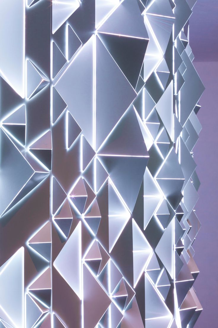 an abstract wall made up of silver squares