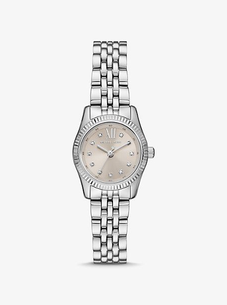 The Lexington watch exudes everyday glamour with its silver hue and sparkling pavé accents at the hour markers. Made entirely of stainless steel, this mini timepiece boasts a cream-hued pearlescent face with a beveled topring and a matching bracelet strap. Slip it on to give both day and night outfits a dose of sophisticated charm. Silver Watch For Women, Simple Silver Watch, Dainty Watch Silver, Timeless Silver Watches With Diamond Accents, Silver Watch Aesthetic, Elegant Silver Watches With Diamond Hour Markers, Teen Watches, Michael Kors Diamond Metal Watch, Michael Kors Watch Silver