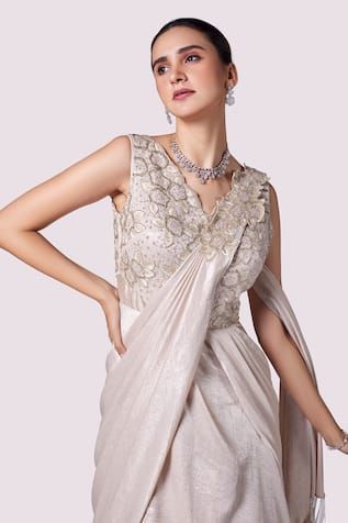 Beige layered saree gown in lurex lycra featuring floral cutdana, tikki, bead, and resham embellishments on the bodice, Fit: Relaxed Lycra Gown, Embellished Saree, Saree Gowns, Draped Gown, Sharara Suits, Drape Gowns, Gown For Women, Saree Gown, Embroidered Sarees