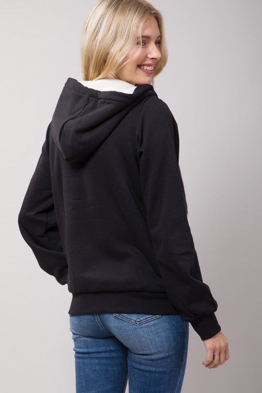 Featuring: Sherpa Lining/ Long sleeve/ Zip-up Front.Model is wearing a size Medium. Model Specs: Height: 5'8" / Bust: 34C / Waist: 24" / Hips: 34" Fabric Contents: 60% Cotton, 40% Polyester Casual Hooded Top With Fleece Lining, Casual Fleece Outerwear With Double-lined Hood, Winter Fleece Tops With Fleece Lining, Fleece Tops For Cold Weather And Winter, Winter Double-lined Hooded Top, Winter Fleece Tops With Adjustable Hood, Black Top With Fleece Lining For Winter, Black Fleece-lined Top For Winter, Winter Hoodie With Fleece Lining