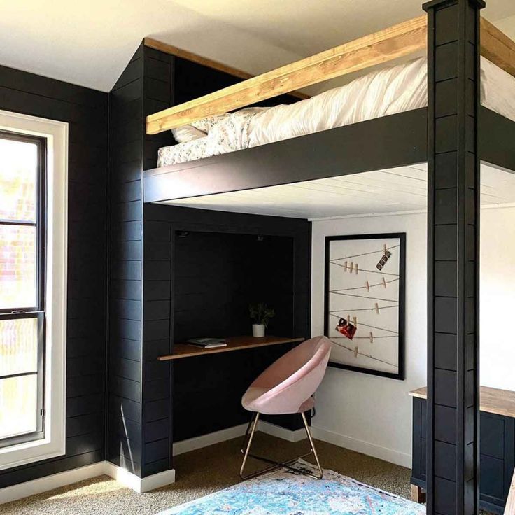 there is a loft bed with a desk in the corner and an office chair underneath it