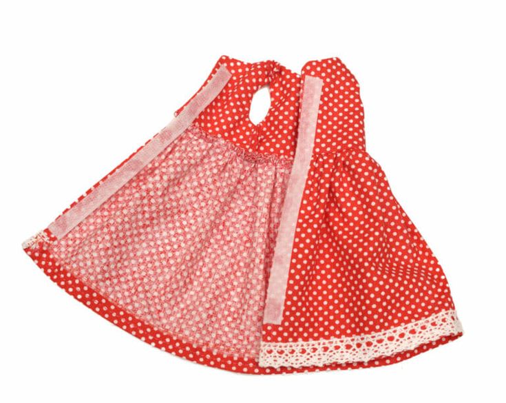 a red and white dress with polka dots on the skirt is shown in front of a white background