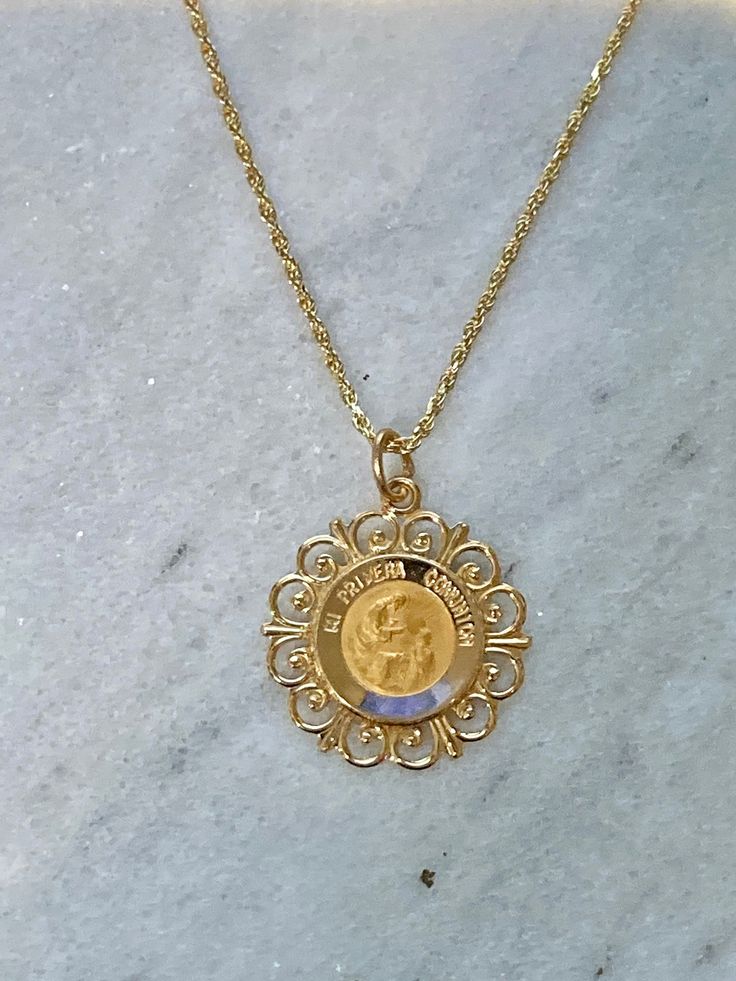 "Ornate Version , beautiful pendant Spanish \"Mi Primera Comunion\" 14K yellow gold, solid, written \"Mi Primera Comunion\" -In stock, ships within 1-2 business days -solid 14k yellow gold, not plated or gold filled. -approximately 3/4 Inch in diameter -Perfect for special gift for first commuion -ideal for both gender Communion -ideal for a special gift -ideal size to be medium sized style charm -14K yellow gold (photograph in 14K yellow gold) Chain A: Dainty cable style chain in 14K yellow gol Gold Plated Yellow Gold Medallion Necklace, Celebration Yellow Gold Plated Necklaces, Engraved Yellow Gold Necklaces For Celebration, Gold Plated Yellow Gold Medallion Jewelry, Engraved Yellow Gold Jewelry For Celebration, Yellow Gold Engraved Necklaces For Celebration, Engraved Yellow Gold Necklace For Celebration, 14k Gold Plated Pendant Necklace, Yellow Gold Pendant Necklace For Celebration