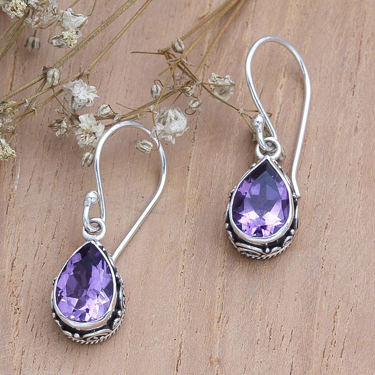 Totaling over two carats, amethyst stones add a glamorous touch to this accessory handcrafted in Bali. Presented by Komang Wijayana, the sterling silver dangle earrings have a combination finish that enhances every detail. On top of that, the gems hide a special meaning: wisdom and truth. Pierced Amethyst Crystal Earrings, Fine Jewelry Amethyst Drop Earrings, Amethyst Drop Earrings Fine Jewelry, Lavender Earrings With Gemstone Accents For Gift, Amethyst Teardrop Crystal Earrings, Purple Teardrop Crystal Earrings In Sterling Silver, Lavender Amethyst Gemstone Earrings, Lavender Gemstone Earrings, Amethyst Gemstone Teardrop Earrings Gift