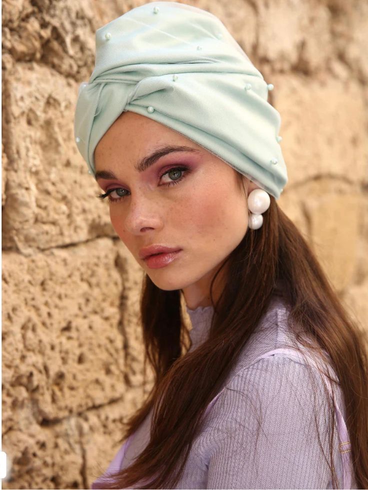 This Tule + Pearl turban is a statement piece perfect for accompanying your holiday and special occasion outfits. Featuring a gorgeous wavy detail that adds dimension and subtly steals the show with its soft color, this unique turban is bound to get those compliments rolling. The turbans are designed to be worn easily- there's absolutely no tying or closing involved simply wear like a cap. Handmade. Soft, minimal seams feel gentle against sensitive skinGathering and details provide flattering vo Elegant Adjustable Headscarf For Party, Elegant Summer Headwrap, Elegant Party Headscarf Headband, Elegant Party Headband Headscarf, Elegant Green Headwrap For Party, Elegant Green Headwrap For Weddings, Chemo Turbans, Women Turban, Head Turban