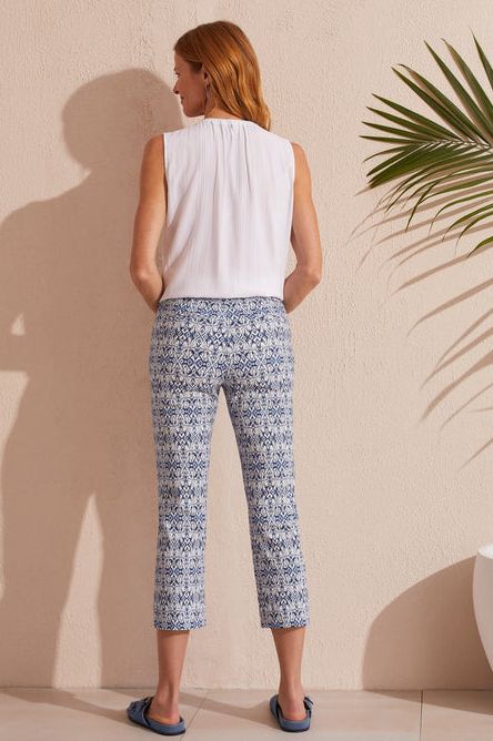 These pull-on capris are a low-maintenance pick that stays stylish with an intricate pattern in a soothing blue hue. We can't get enough of the elastic waist and stretch bengaline fabric that provides lasting comfort, flattering kick flare leg, 25" inseam, functional front pockets, and decorative back welt pockets. Pull-on elastic waist Kick flare leg 25" inseam Real front pockets, decorative back welt pockets 76% Rayon/Rayonne 21% Nylon 3% Spandex Machine wash delicate cycle cold water, separat Clothes For Women Over 50, Capri Trousers, Swimsuit With Shorts, Ikat Print, Kick Flares, Swimsuit Dress, Capri Blue, Dress Pant, Blue Star