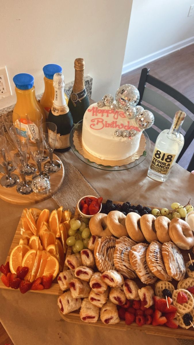 a table topped with lots of different types of food and drinks on top of it