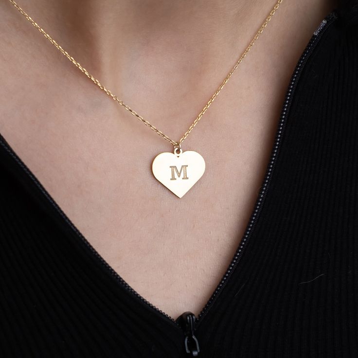 💖 Welcome to our collection of timeless elegance and personalized charm! Our Gold Heart Initial Necklace is a heartfelt tribute to individuality and love. ✨ Each necklace features a delicate 14K solid gold chain adorned with a dainty heart pendant, expertly engraved with your chosen initial. 🎁 Versatile and enduring, this necklace is an ideal gift for any occasion. Celebrate Mother's Day with a thoughtful token of appreciation, surprise a friend on their birthday with a personalized touch, or Classic Yellow Gold Heart Necklace For Gift, Classic Yellow Gold Heart Necklace As Gift, Anniversary Necklace With Heart Charm And Initial Pendant, Elegant Personalized Heart Pendant Charm Necklace, Elegant Heart Pendant Charm Necklace For Personalized Gift, Elegant Heart Pendant Necklace With Hallmarks, Elegant Charm Necklaces For Valentine's Day Personalized Gift, Classic Necklace With Heart Charm Gift, Elegant Personalized Charm Necklace For Valentine's Day