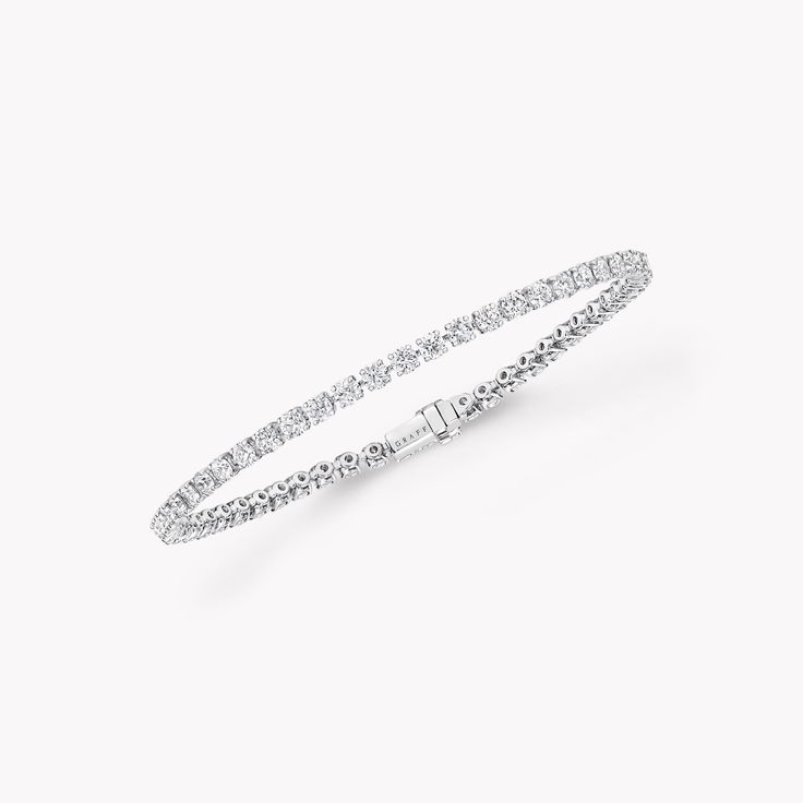 The ultimate expression of timeless design, our round diamond bracelet in white gold from the Classic Graff collection is simply stunning. The diamonds are embraced in minimal metal settings, creating a delicately scintillating statement on the wrist. The Classic Graff collection is the epitome of elegance – a unique selection of jewels designed to showcase the remarkable purity and brilliance of the finest Graff diamonds. An elegant Classic Graff round diamond bracelet with a total weight of ap Round Diamond Bracelet, Girl Wishlist, Graff Jewelry, Graff Diamonds, Diamond Drop Necklace, Diamond Earrings Studs Round, Bracelet Tennis, Diamond Bangles Bracelet, Branding Marketing