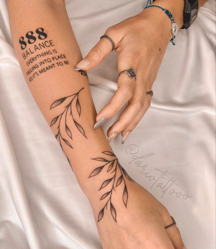 a woman's arm with tattoos on it and the words, 8 / 8