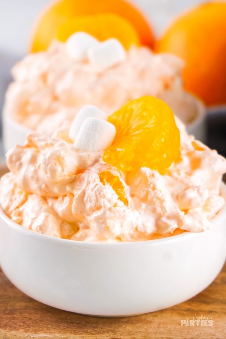 a bowl filled with orange fluff and marshmallows