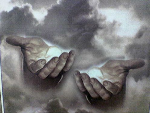 two hands touching each other with the words in god's hand