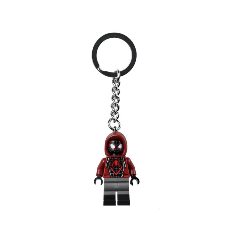 a lego keychain with a spider - man face on it's side