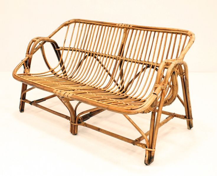 a wooden bench made out of rattan and wicker