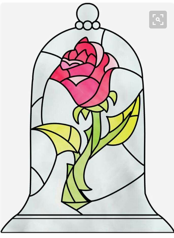 a stained glass window with a rose in it